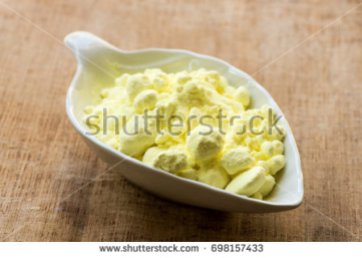 stock-photo-sulfur-or-sulfur-on-old-wood-background-698157433